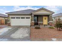 Single-story house with attached garage and desert landscaping at 36060 W Santa Clara Ave, Maricopa, AZ 85138