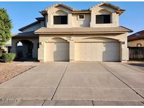 Charming two-story home with a spacious driveway and a well-maintained front yard at 3664 E Juanita Ave, Gilbert, AZ 85234