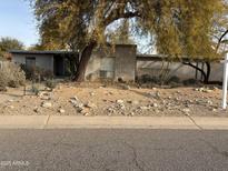 Ranch style home with brick exterior and a landscaped front yard at 6240 E Larkspur Dr, Scottsdale, AZ 85254