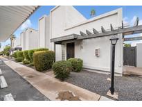 Attractive exterior of the home with landscaping and walkway at 8578 E Indian School Rd # I, Scottsdale, AZ 85251