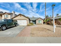 Charming single-story home with a two car garage and low maintenance landscaping at 8818 W Virginia Ave, Phoenix, AZ 85037