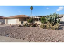 Single story home with desert landscaping and covered patio at 1681 Leisure World --, Mesa, AZ 85206