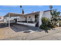 Mobile home with covered patio and carport at 5933 E Main St # 47, Mesa, AZ 85206