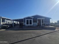 Single-story home with carport and landscaped yard at 650 N Hawes Rd # 2709, Mesa, AZ 85207