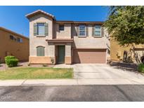 Two-story house with a two-car garage and well-maintained landscaping at 8454 E Keats Ave, Mesa, AZ 85209