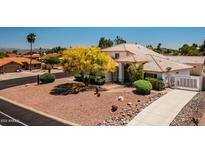 Two-story house with tile roof, desert landscaping, and gated entry at 17149 E El Pueblo Blvd, Fountain Hills, AZ 85268