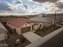 Aerial view of single-story house with brown roof and desert landscaping at 19587 W Marshall Ave, Litchfield Park, AZ 85340