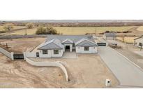 Aerial view of a single-story house with a large backyard and paved driveway at 22707 W La Mirada Dr, Buckeye, AZ 85326