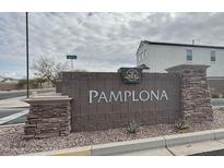 Welcoming community sign for Pamplona with stone accents and neighborhood features at 30968 W Monterey Ave, Buckeye, AZ 85396