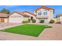 Charming two-story home with a well-manicured lawn and desert landscaping at 3352 E Hopi Ave, Mesa, AZ 85204