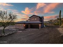 Stunning two-story home with stone accents and a three-car garage at 36430 N 34Th Ave, Phoenix, AZ 85086