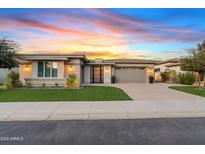 Stunning modern home with a welcoming front yard and attached garage at 3990 E Alameda Ln, Gilbert, AZ 85298