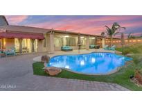 Inviting pool and patio area, perfect for entertaining at 6107 W Hedgehog Pl, Phoenix, AZ 85083