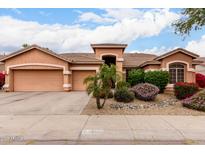 Charming single-story home featuring a well-manicured yard and a spacious three-car garage at 18001 N 53Rd St, Scottsdale, AZ 85254