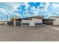 Mid-century modern home with carport and landscaped front yard at 2371 E Larkspur Dr, Phoenix, AZ 85022