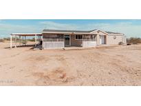 Ranch style home with covered patio and spacious backyard at 3315 N Datura Ct, Maricopa, AZ 85139