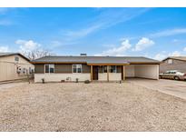 Charming single-story home with a spacious gravel front yard and covered parking at 3717 W Charter Oak Rd, Phoenix, AZ 85029