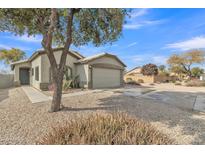 Single-story house with a two-car garage and desert landscaping at 41654 N Ranch Dr, San Tan Valley, AZ 85140