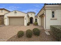 Craftsman style home with two car garage and landscaped front yard at 4937 S Pulse Ter, Mesa, AZ 85212