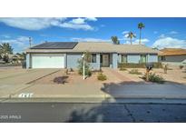 Ranch style home with solar panels and landscaped yard at 762 W Naranja Cir, Mesa, AZ 85210