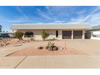 Ranch style home with two-car garage and landscaped front yard at 1122 W Dragoon Ave, Mesa, AZ 85210