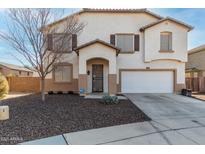 Two-story house with a large garage and landscaped front yard at 12113 W Planada Ln, Sun City, AZ 85373