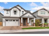 Charming two-story home with brick accents, attached garage, and well-maintained landscaping at 1332 E Sierra Vista Dr, Phoenix, AZ 85014