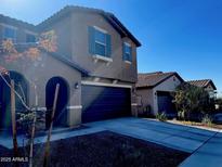 Two-story house with a two-car garage and desert landscaping at 18225 W Yavapai St, Goodyear, AZ 85338