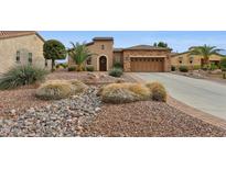 Beautiful desert landscape surrounds this single-story home with a large garage at 28365 N 124Th Dr, Peoria, AZ 85383