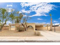 Ranch style home with carport and landscaped front yard at 4809 W Sandra Ter, Glendale, AZ 85306