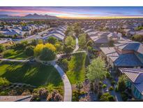 Aerial view of a community with houses, parks, and walking paths at 813 E Verde Blvd, Queen Creek, AZ 85140