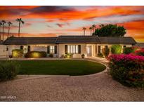 Stunning curb appeal with a beautifully landscaped lawn at 980 Castillo E Dr, Litchfield Park, AZ 85340