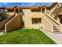 Attractive exterior of a two-story condo building with grassy landscaping at 1126 W Elliot Rd # 1058, Chandler, AZ 85224