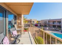 Private balcony with patio furniture and pool view at 16616 E Palisades Blvd # 201, Fountain Hills, AZ 85268