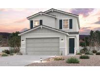 Two-story house with gray siding, dark green shutters, and a two-car garage at 17345 W Jessie Ln, Surprise, AZ 85387