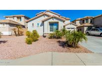 Two-story house with a landscaped yard and driveway at 25822 W Magnolia St, Buckeye, AZ 85326