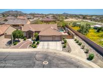 Single-story home with three-car garage, pool, and landscaped yard at 3818 N Kalispell Ct, Casa Grande, AZ 85122