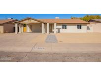 Charming single-story home featuring a covered carport and desert landscaping at 4220 W State Ave, Phoenix, AZ 85051