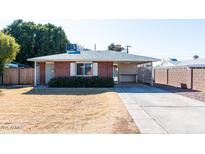 Brick ranch home with carport and spacious yard at 621 W Howe St, Tempe, AZ 85281