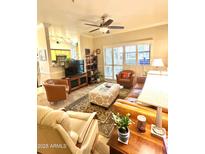 Bright living room with leather furniture and a cozy atmosphere at 14950 W Mountain View Blvd # 5112, Surprise, AZ 85374