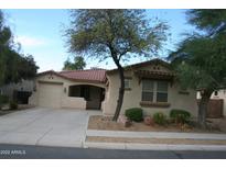 Cute one-story house with a two-car garage and desert landscaping at 17274 W Morning Glory St, Goodyear, AZ 85338