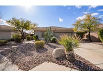 Single-story home with desert landscaping and two-car garage at 2927 W Plum Hollow Dr, Anthem, AZ 85086