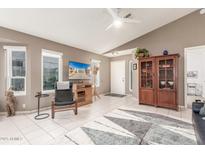 Living room with comfy seating and wood cabinet at 4044 W Whispering Wind Dr, Glendale, AZ 85310