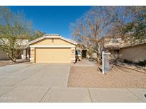 Cute one-story house with a two-car garage and desert landscaping at 12000 W Bloomfield Rd, El Mirage, AZ 85335