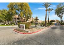 Community entrance with fountain and landscaping at 1211 N Miller Rd # 201, Scottsdale, AZ 85257