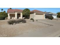 Single-story home with a two-car garage and desert landscaping at 14422 W Via Tercero --, Sun City West, AZ 85375