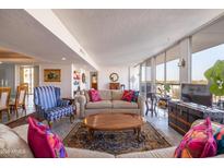 Bright living room with city views, featuring comfortable sofas and a large window at 2323 N Central Ave # 504, Phoenix, AZ 85004