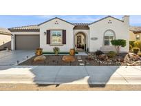 Single-story home with a two-car garage and landscaped front yard at 26019 W Ponderosa Ln, Buckeye, AZ 85396