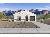 White stucco house with brown garage door and desert landscaping; mountain views at 5552 E Rock Bush Ln, San Tan Valley, AZ 85140