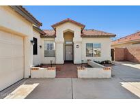 Single-story home with tile roof, attached garage, and landscaped front yard at 8527 W Aster Dr, Peoria, AZ 85381